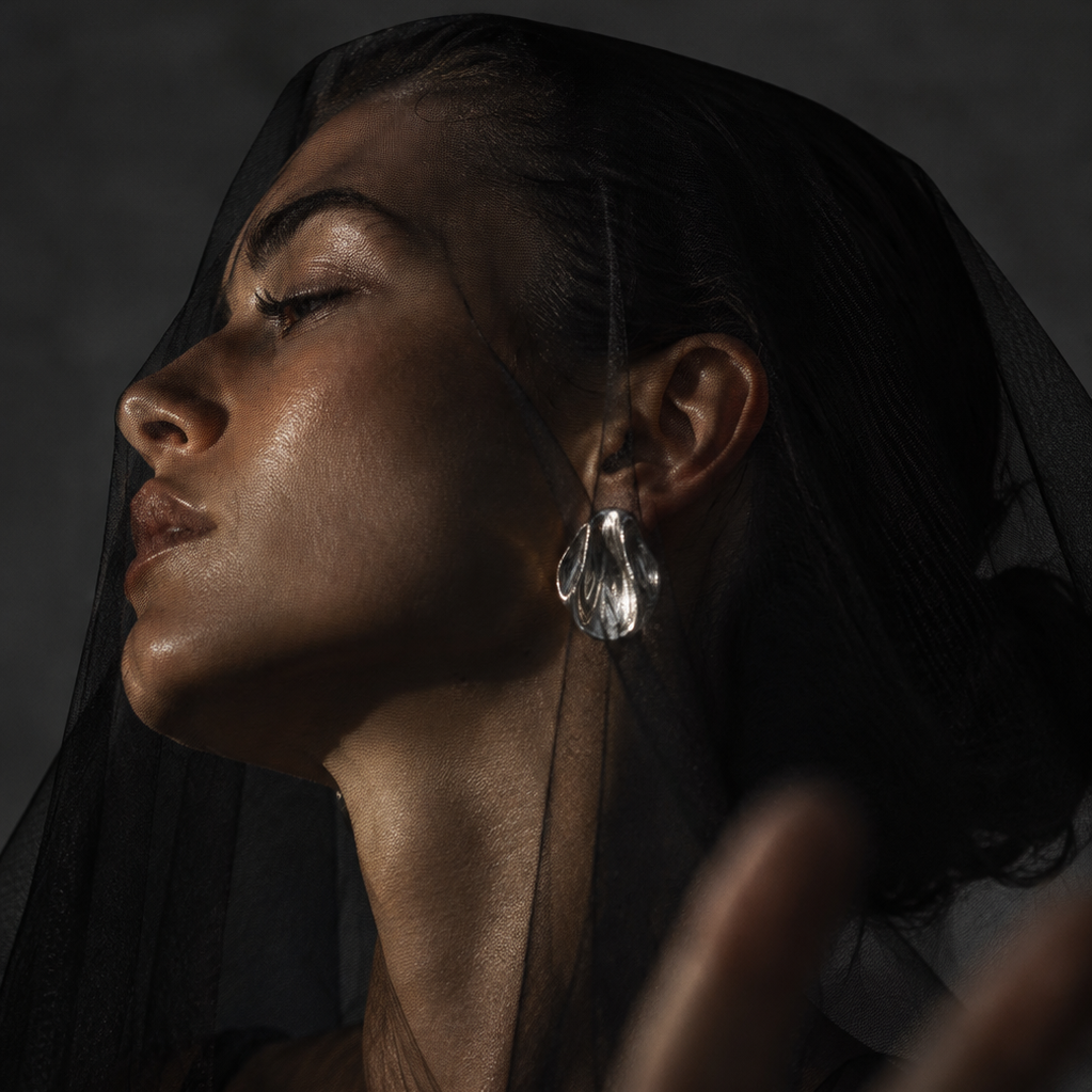 Alba Earrings Silver worn on model – organic sculptural polished silver stud earrings by Arina Linea